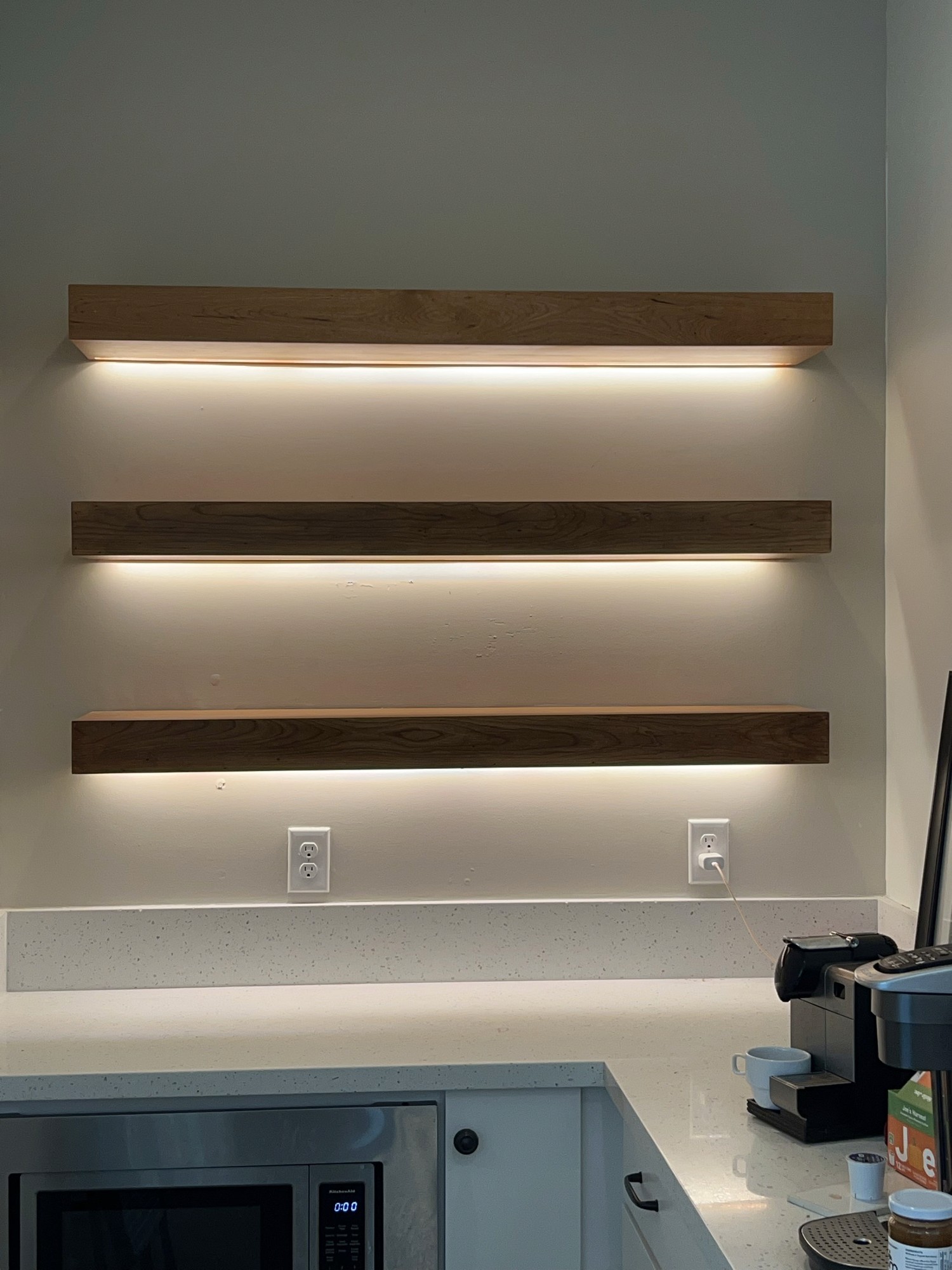 Floating wood shelves with integrated LED lighting